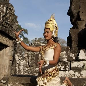 Girl dancer wearing Apsara (dancer) costume in Khmer temple, Bayon, Angkor Thom, Siem Riep, Cambodia