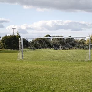 Goal posts on village football pitch, in evening sunshine, Bacton, Suffolk, England, october
