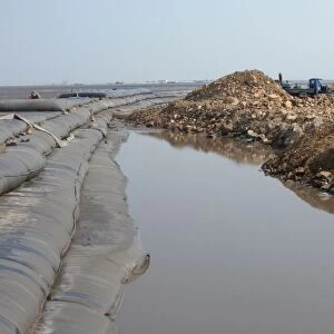 Land reclaimation project, reclaiming mudflats using inflatable booms, Hebei, Bohai Gulf, Yellow Sea, China, may