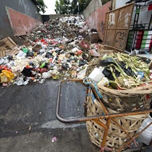 Large pile of rubbish and collection baskets in city, Manggarai District, Jakarta, Java, Indonesia, December