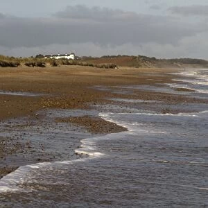 Low tide on Minsmere Beach, looking towards Dunwich and the coast guard cottages - Suffolk