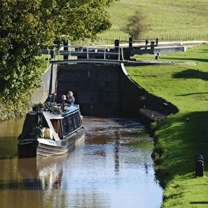 Narrowboat leaving canal lock, built from iron because of sandy soil conditions, Beeston Iron Lock