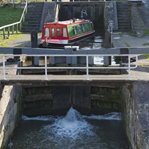 Narrowboat moving through canal staircase lock, Bunbury Locks, Shropshire Union Canal, Bunbury, Cheshire, England