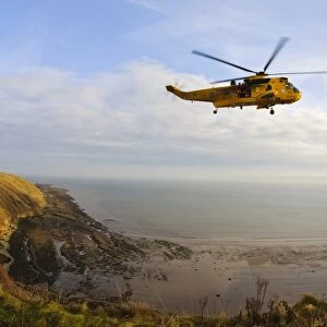 RAF Westland Sea King rescue helicopter with crew members standing in open doorway