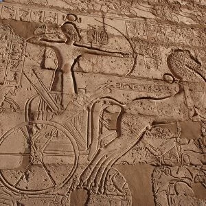 Relief showing Ramesses II on chariot slaying enemies, The Ramesseum (Mortuary Temple of Pharaoh Ramesses II)