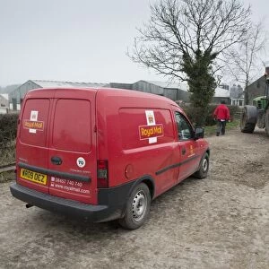 Royal Mail van and postman, delivering post to farm, Preston, Lancashire, England, March