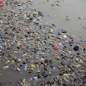 Rubbish floating on river in city, Manggarai District, Jakarta, Java, Indonesia, December