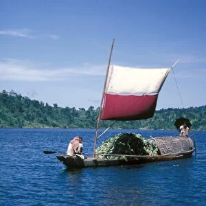 sampan transport boat in Bangladesh moving bananas, taken in the 1960s by Eric Hosking when the country was known as