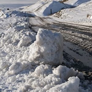 Snow and slush covered road on moorland, Yorkshire Dales N. P. North Yorkshire, England, January