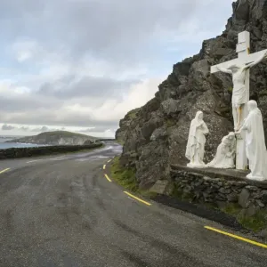 Statue with Jesus on Crucifix with Mary and Saint John, beside coastal road, Coumeenole South, Slea Head Statue with Jesus on Crucifix with Mary and Saint John, beside coastal road, Coumeenole South, Slea Head
