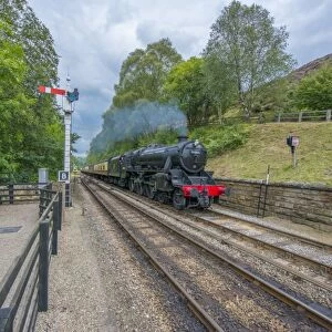 Steam train and carriages, travelling on heritage railway from Pickering to Goathland, North Yorkshire Moors Railway