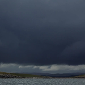 Stormclouds and coastline, over Weisdale and Nesting, Mainland, Shetland Islands, Scotland, June