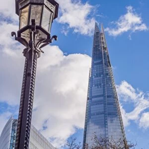Streetlamp and 87-storey skyscraper, The Shard, Southwark, London, England, January