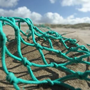 Trawl net washed up on beach, Gower Peninsula, West Glamorgan, Wales, March