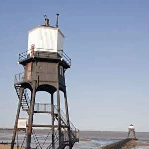 Victorian cast iron lighthouses on beach, Dovercourt, Harwich, Essex, England, July