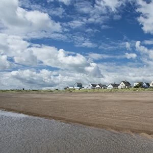 View of beach and coastal hamlet, Anderby Creek, Lincolnshire, England, June