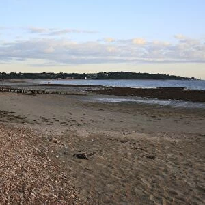 View of beach with incoming tide at dawn, Bembridge, Isle of Wight, England, june