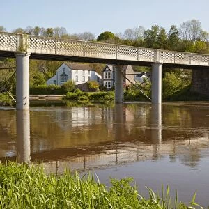 View of bridge with village on riverbank, Brockweir Bridge, Brockweir, River Wye, Lower Wye Valley, Forest of Dean