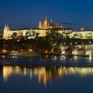 View of Charles Bridge (Karluv Most), Prague Castle and St. Vitus Cathedral at night, Vltava River, Prague