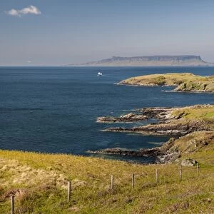 View of coastline and distant island, looking towards Eigg, Small Isles, across Sound of Sleat from Aird of Sleat
