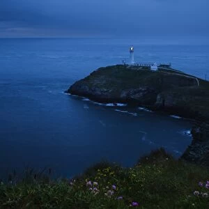 View of coastline and lighthouse at dusk, South Stack Lighthouse, Holyhead, Holy Island