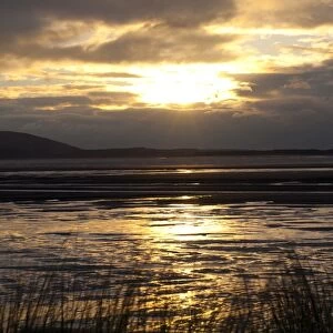 View across estuary at sunset, River Loughor, from Llanelli to Gower Peninsula, Carmarthenshire, Wales, January
