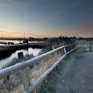 View of flooded wetland habitat and pull-in viewing point at sunrise, East Flood, Oare Marshes Nature Reserve