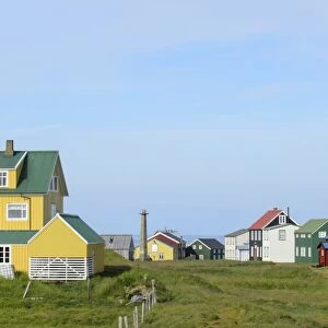 View of houses in coastal settlement, Flatey Island, Iceland, July