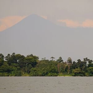 View of lake with volcano in distance, Lake Kivu, Albertine Rift, Democratic Republic of Congo, November