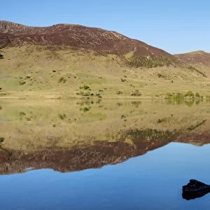 View of mountains reflected in lake, Crummock Water, Lake District N. P. Cumbria, England, June