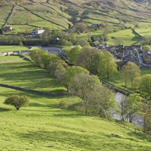 View of pasture, trees, river and village, River Wharfe, Burnsall, Wharfedale, Yorkshire Dales N. P