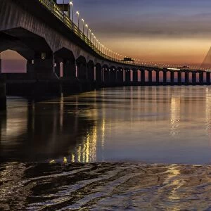 View of road bridge over river at sunset, viewed from Severn Beach, Second Severn Crossing, River Severn