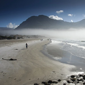 View of sandy beach shrouded in sea mist, Hout Bay, Cape Town, Western Cape, South Africa