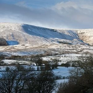 View of snow covered farmland and fell, looking towards Fair Oak Fell (left) Whitmore Fell (centre) and Totridge Fell from Long Knots, Whitewell, Lancashire, England, december