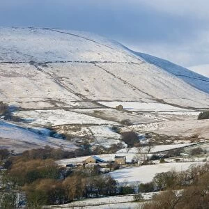 View of snow covered farmland and fell, looking towards Totridge Fell from Long Knots over Higher Fence Wood, Whitewell, Lancashire, England, december