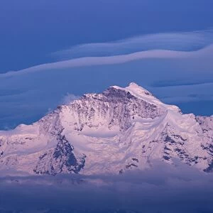 View of snow covered mountain summit at dusk, Jungfrau, Swiss Alps, Bernese Oberland, Switzerland, June