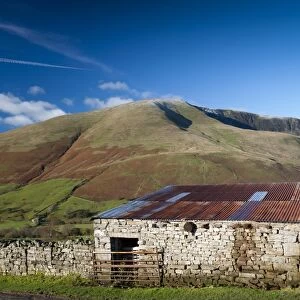 View of stone barn and farmland in fell valley, looking from Bluecaster, Cautley Crag, Sedbergh, Howgill Fells