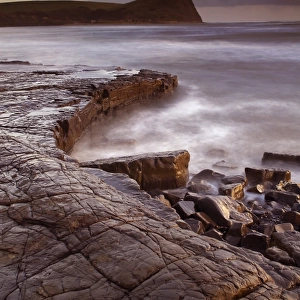 View of wave-cut platform and rocky shore at sunset, The Flats, Kimmeridge Bay, Isle of Purbeck, Dorset, England