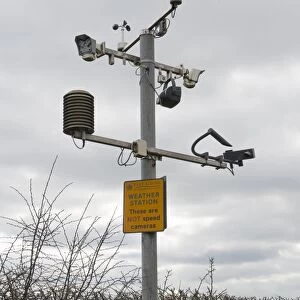 Weather station with These are not speed cameras sign, Garrowby Hill, Garrowby, East Yorkshire, England, march