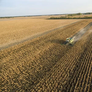 Corn Harvest, John Deere combine harvesting corn - aerial Marion Co. IL