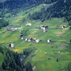 Europe, Italy, Dolomite Alps. This tiny village is perched on a hillside in the Dolomite Alps