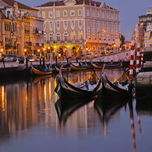 Europe; Portugal; Averio; Moliceiro Boats Along the main canal of Averio With Night Lights