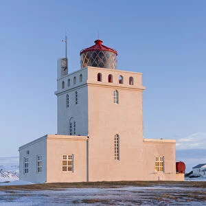 The lighthouse at cape Dyrholaey. Coast of the North Atlantic near Vik y Myrdal during winter