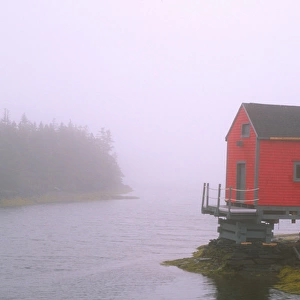 N. A. Canada, Nova Scotia, Stonehurst. Red fishing shed in fog