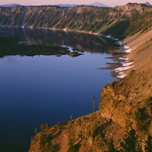 USA, Oregon. Crater Lake National Park, sunrise light on Wizard Island, view south
