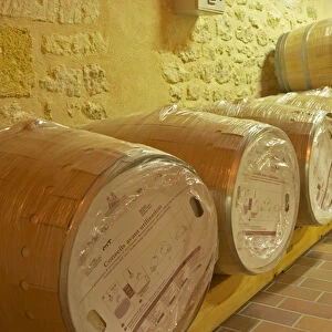 in the wine cellar: new Barriques barrels in their original packaging - Chateau Grand Mayne