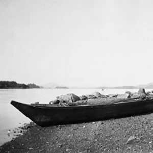 ALASKA: DUGOUT CANOE, 1905. A Tlingit dugout canoe on the shore at Sitka, Alaska