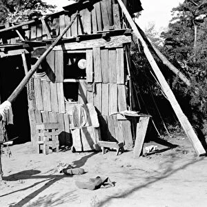 ARKANSAS: SHACK, 1935. A squatters shack in Arkansas. Photograph by Ben Shahn