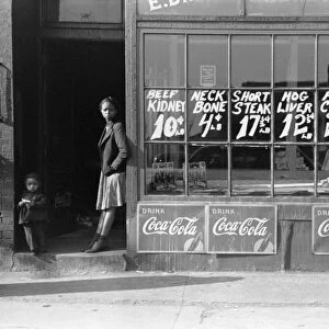 BUTCHER SHOP, c1939. Exterior of a butcher shop, probably Chicago, Illinois. Photograph