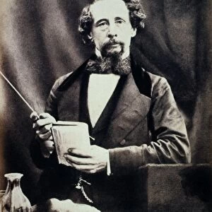 CHARLES DICKENS (1812-1870). English novelist. About to begin a public reading
